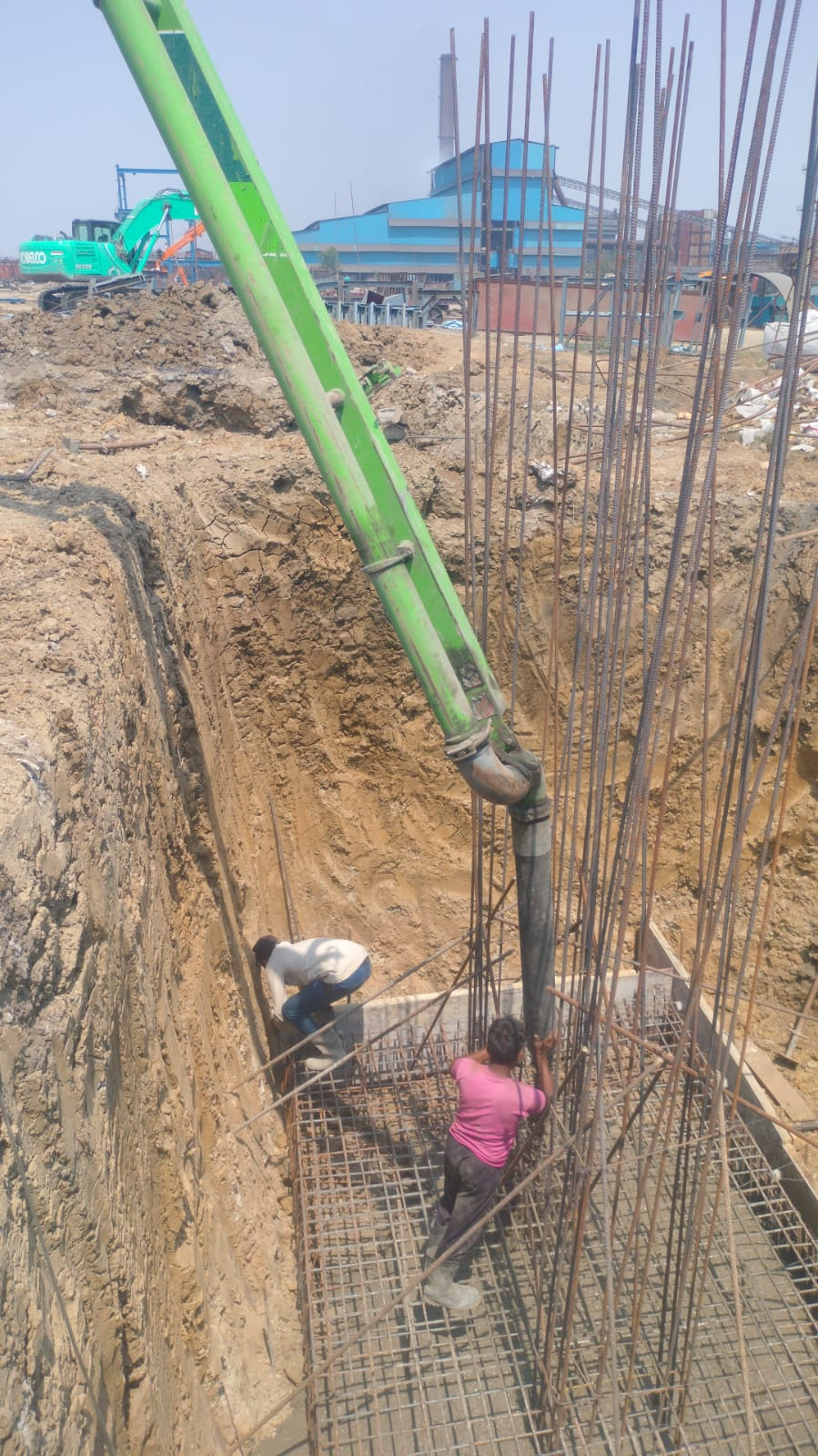 Concrete pump pour on foundation site